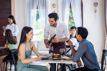 Caucasian waiter receiving order serving from customer in restaurant. 