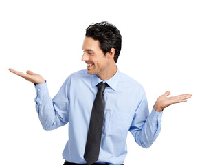A cheerful young male business model smiling gracefully and holding and looking at the product in a copy space isolated on a png background.