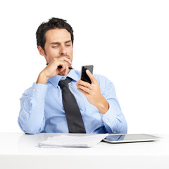 A wondering businessman sitting at his desk and checking his cellphone isolated on a png background