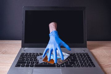 Cybercrime. Theft of money through online services. Unprotected computer from cyber attacks.