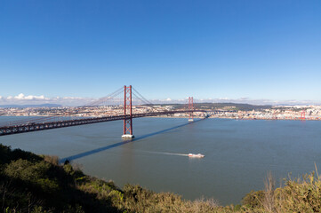 Landscape of the April 25 bridge between Almada and Lisbon - Portugal
