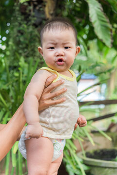 child lies and starts to babble, 7 months old asian baby boy,baby talk