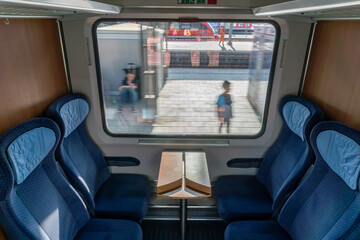 Interior of German InterCity train departing Augsburg - obrazy, fototapety, plakaty