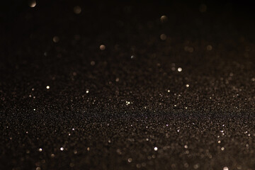 Black glittering background for design and free space.