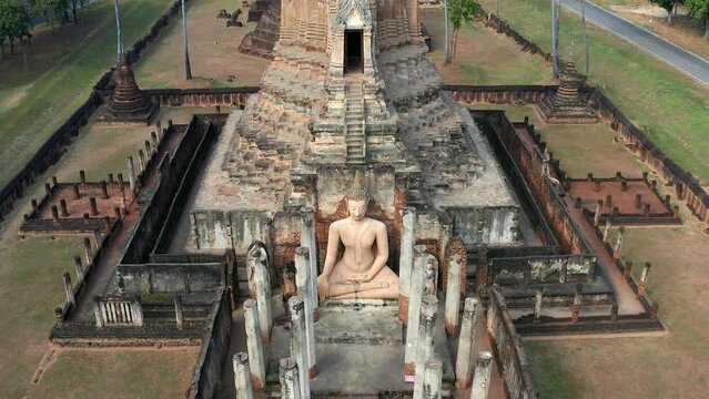 Aerial view of Wat Pikul Thong Phra Aram Luang or Wat Luang Por Pae temple with giant Buddha, in Sing Buri, Thailand