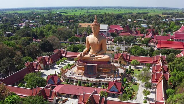 Aerial view of Wat Pikul Thong Phra Aram Luang or Wat Luang Por Pae temple with giant Buddha, in Sing Buri, Thailand