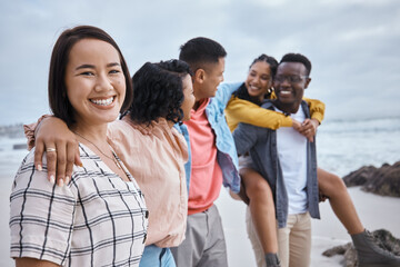 Asian woman, portrait and smile of friends at beach, ocean and outdoor nature for fun, happiness and travel. Diversity of happy young people at sea for holiday, vacation and relaxing weekend together