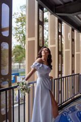 Full length portrait of beautiful model woman in white dress posing summer