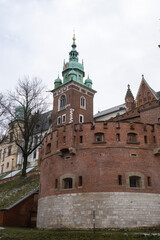 Fototapeta na wymiar Royal Wawel royal castle in Krakow in rainy early spring weather in Poland. historic castle in the old city Gardens and cathedra, Cracow, Poland. Travel attraction