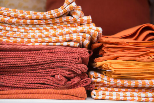 Folded drapery on racks in clothes shop, Augsburg, Bavaria, Germany,