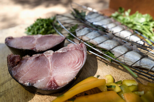 Close-up of tuna fish with bell pepper and mackerel on chopping board, Puglia, Italy