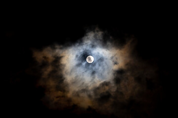 Obraz na płótnie Canvas Bright full moon on cloudy scene of night sky.