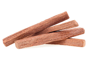 Pile of sandalwood sticks isolated on a white background. Chandan.