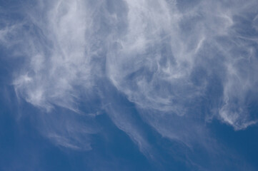 Windy Clouds In A Blue Sky