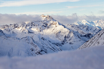 Snowy mountains in the clouds. Solden in the Austrian Alps.