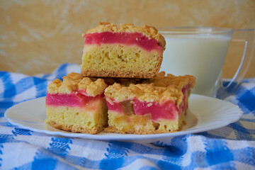 cake with rhubarb and jelly,slices of homemade rhubarb pie with milk
