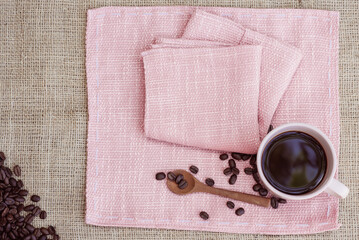 Pink coffee mug on pink tablecloth