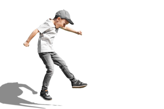 a Young boy runs in the jump on the street on a bright blue background