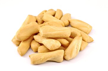 Italian short crispy olive breadsticks on white background. Texture.