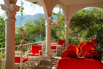 Aegean region. Veranda with comfortable armchairs and sofas for relaxation. Club and hotel Letoonia five stars in shade of trees. Relaxing atmosphere. Turkey, Fethiye - September 10, 2007