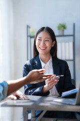 Pointing laptop, Meeting and consulting agenda of indian asia mixed race business man and female china half thai ethnicity bookkeepers discussing balance sheet, stock market profit with yearly tax. © NanSan