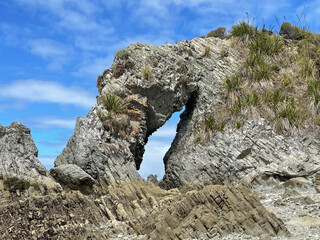 Natural rock arch, Mangawhai Cliff walk, Auckland, New Zealand.