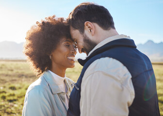 Fototapeta premium Happy, smile and love with couple on farm for agriculture, peace and growth. Teamwork, bonding and hug with man and woman in grass field of countryside for sustainability, health and environment
