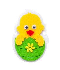 decorative chicken hatched from a green Easter egg made of felt on an isolated background. High quality photo
