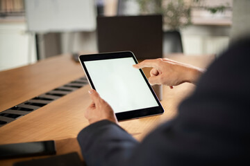Close up of man using digital tablet..