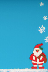 vertical christmas background with santa claus and snowflakes