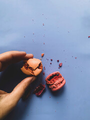 Girl holding macaroon in her hand