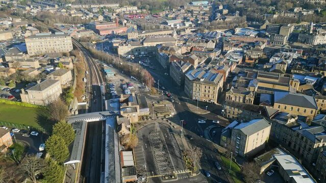 Small town in England showing train station, train and busy town with traffic and roads. Sim City