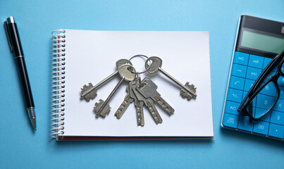 Keys with a business objects on the blue background.