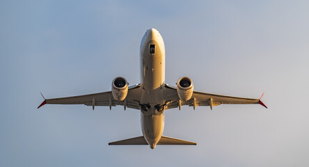 Fototapeta na wymiar Passenger airplane takes off from airport runway.