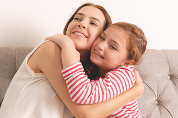Mother and girl hugging together feeling love expression