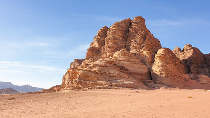 Vast, rugged mountainous desert landscape with red sand of Wadi Rum in Jordan, Middle East 
