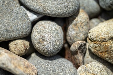 round rocks and pebbles on the beach in australia