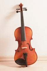 violin lying against a wall 