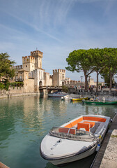 View of the fortress, port and Lake Garda in the old town of Sirmione Italy