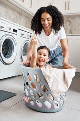 Mom, laundry and girl kid in basket by washing machine for cleaning, bonding or comic time in...