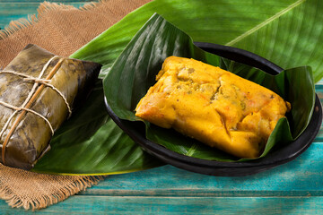 Tamale Typical Colombian Food Wrapped In Banana Leaves - obrazy, fototapety, plakaty
