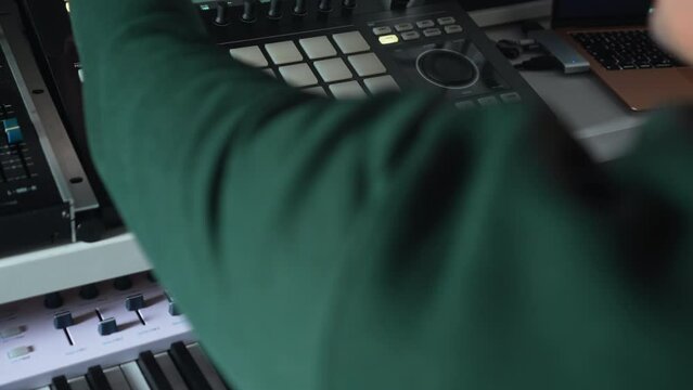 Man DJ creating music on a toolbox for beat making . High quality 4k footage