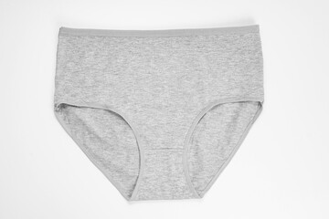 a gray cotton panties on a white background. the concept of classic underwear made of natural fabrics.