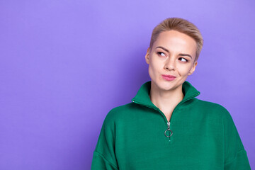 Portrait of pretty minded lady look interested empty space contemplate isolated on purple color background © deagreez