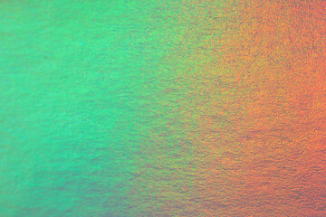 An iridescent holographic foil background pastel colors