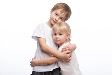 Portrait of a child, the love of brother and sister in his arms on a white background