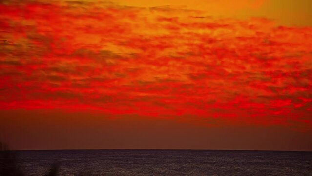 Red ocean sunset, fusion time lapse view