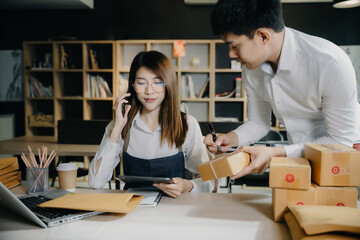 Asian business owner using smartphone contacted a customer asking for a shipping address.