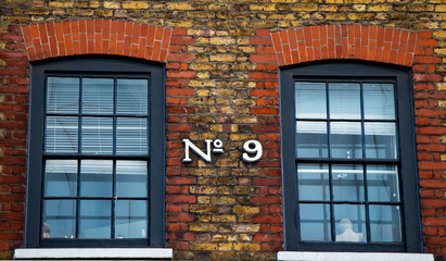 The number nine between two windows in Chinatown, London, England