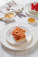 Raspberry Crumble Bars on white plate, top view